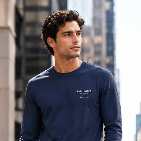 Man in navy outfit walking on a city street