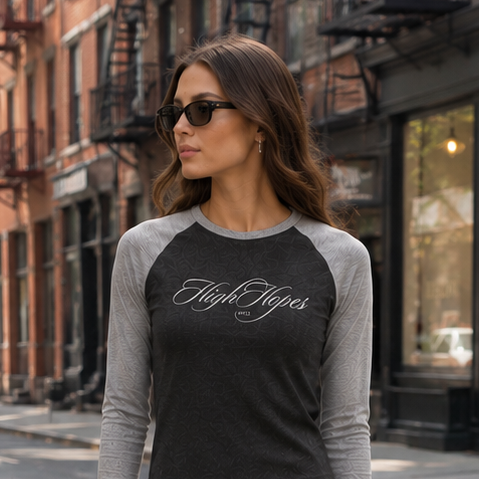 Woman wearing a 'High Hopes' shirt on a city street
