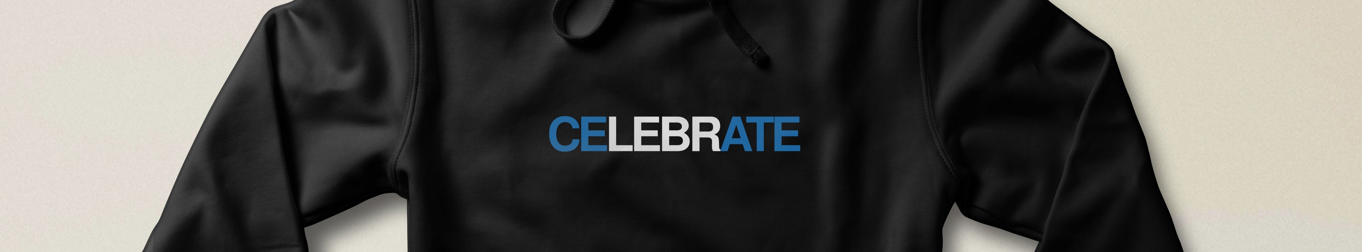 A black pullover hoodie with the word 'CELEBRATE' printed across the chest in blue and white, displayed against a light beige background.